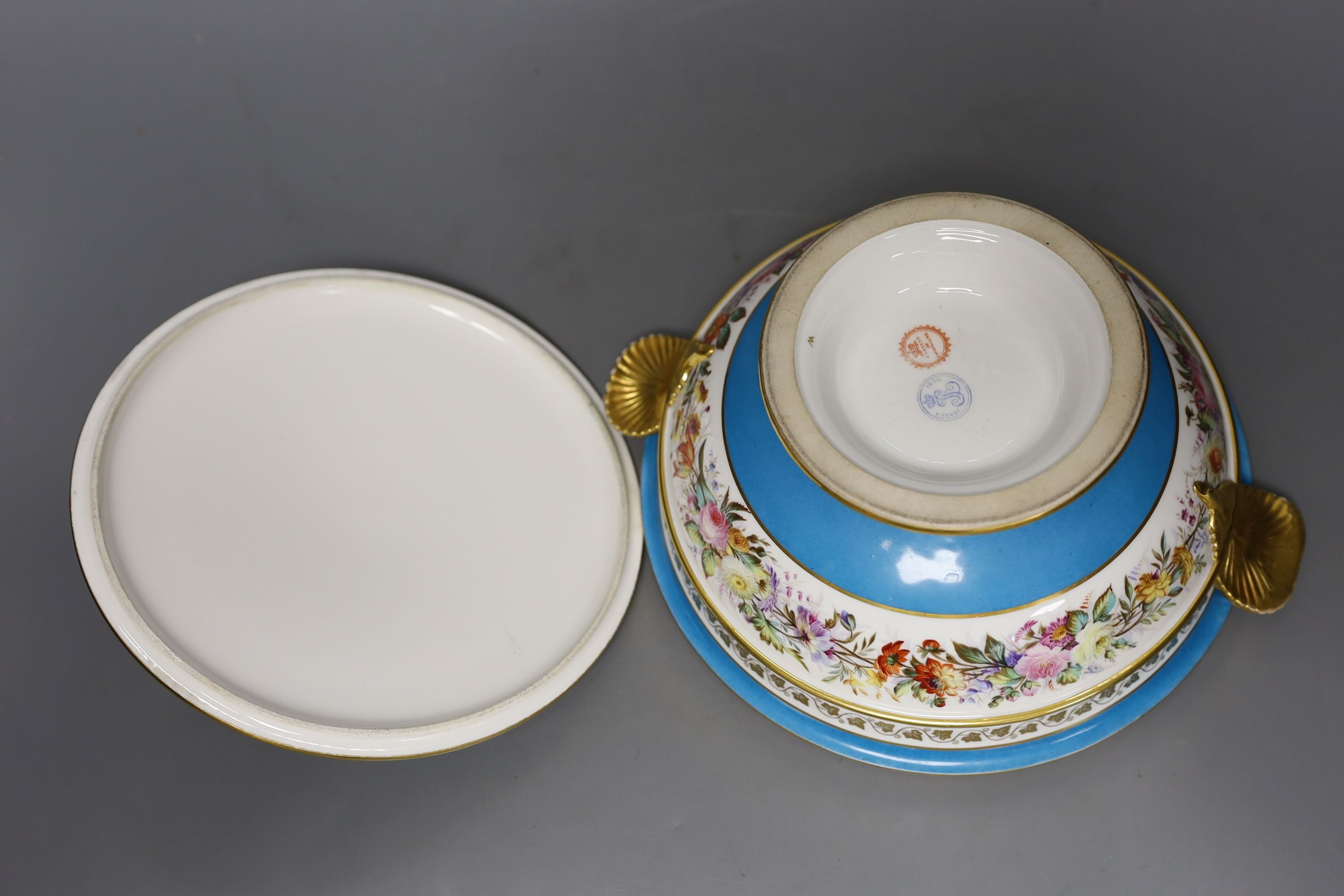 Sevres ecuelle and cover painted with a band of flowers surrounding the gilt monogram of Louis Phillipe, blue mark dated 1850, red mark for Chateau de Compiegne 25cm